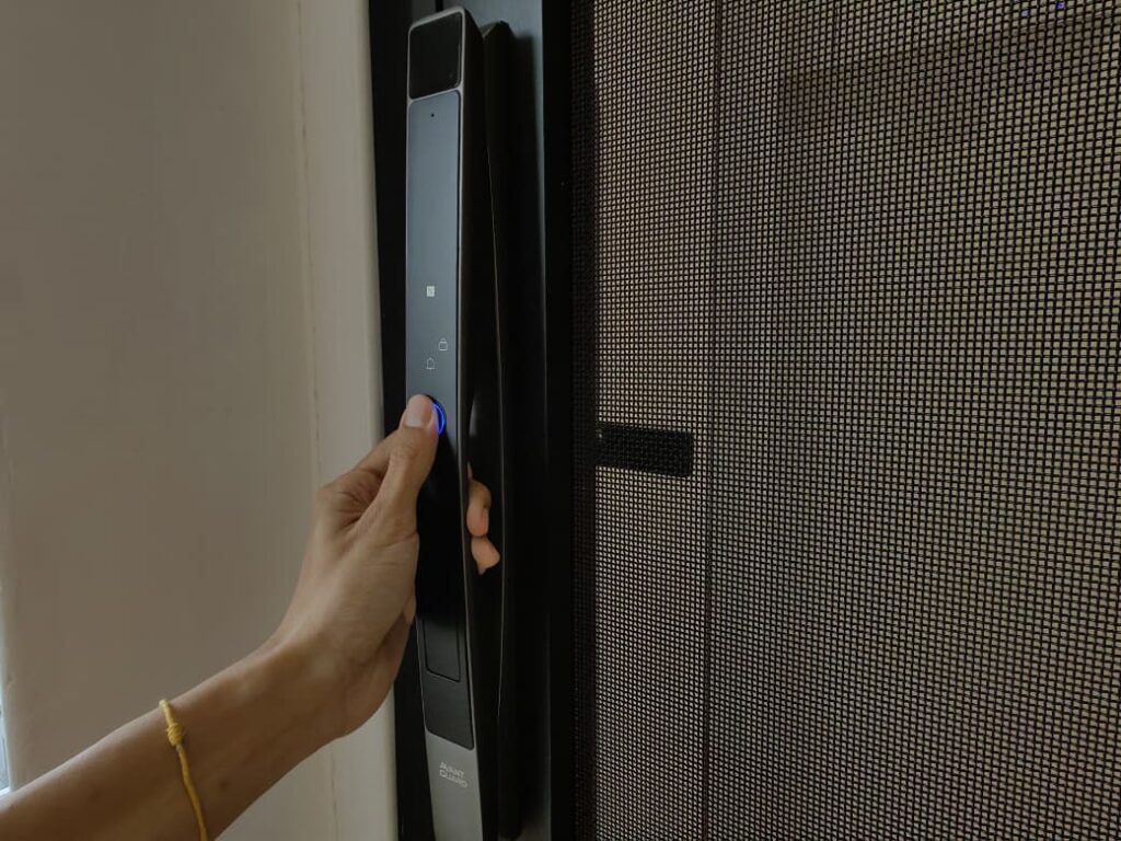 Hand reaching for an Avant Guard digital door lock