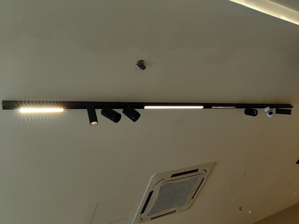 Avant Guard magnetic track lights on a living room ceiling